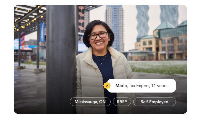 Maria, a tax expert of 11 years, is smiling warmly in an outdoor plaza in Mississauga.