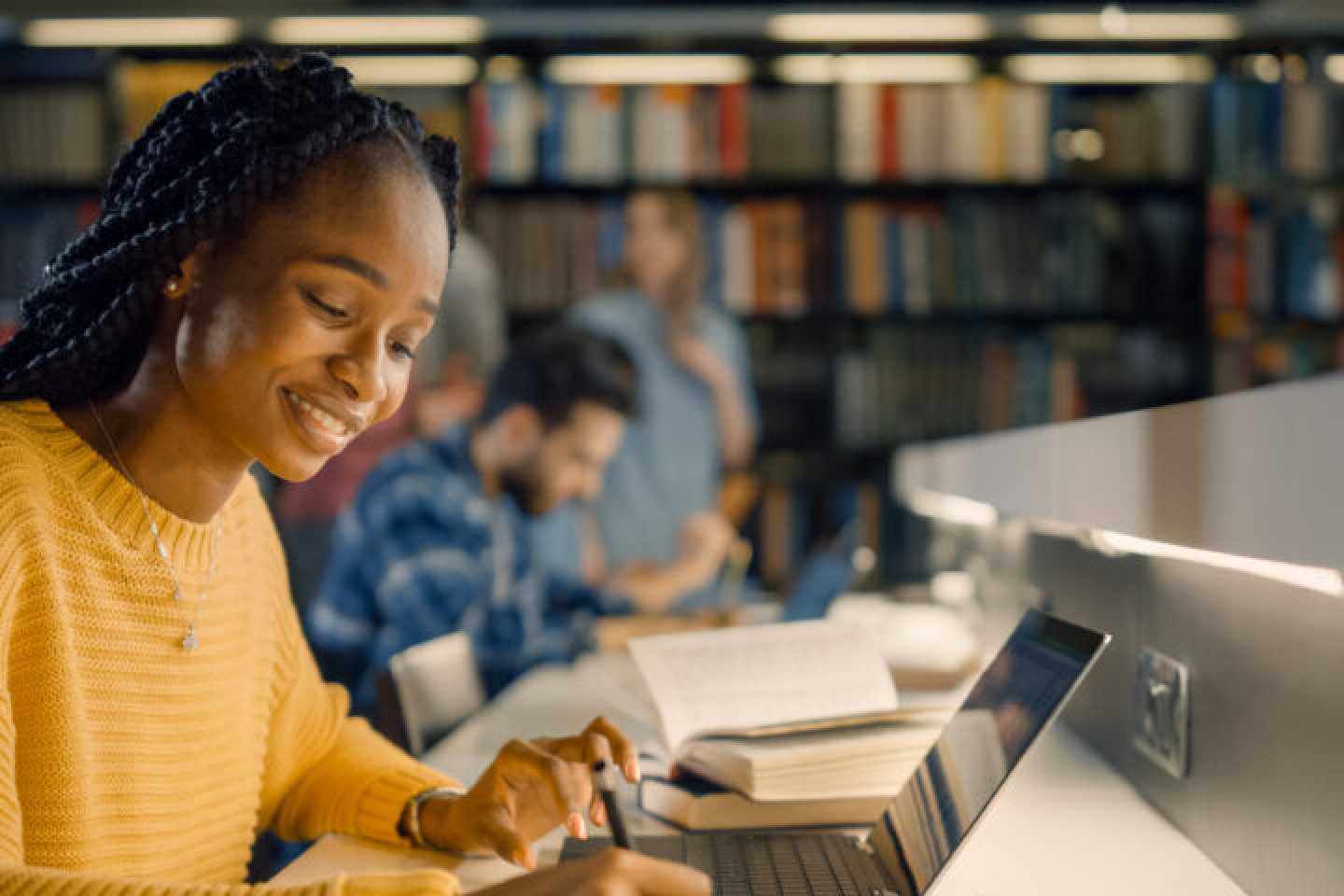 Black student at library working on homework -DESKTOP + TABLET + MOBILE- (1).png