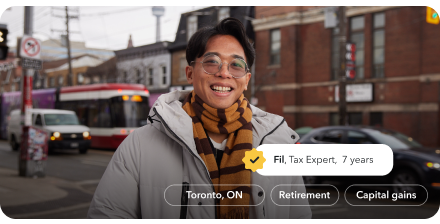Fil, a tax expert of 7 years, is smiling warmly on the streets of Toronto.
