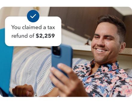 Man holding phone being prompted you claimed a tax refund of $2,259