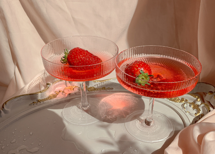 Cocktails with strawberry garnish    