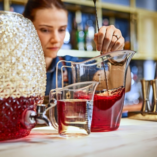 Bartender mixing a batched cocktail