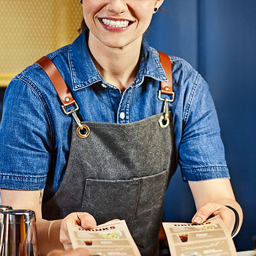 Bartender with two menus