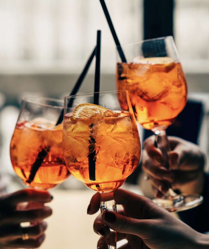 3 spritz cocktails in hands