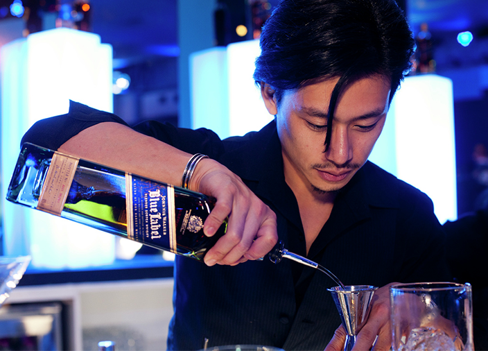 Bartender pouring a cocktail
