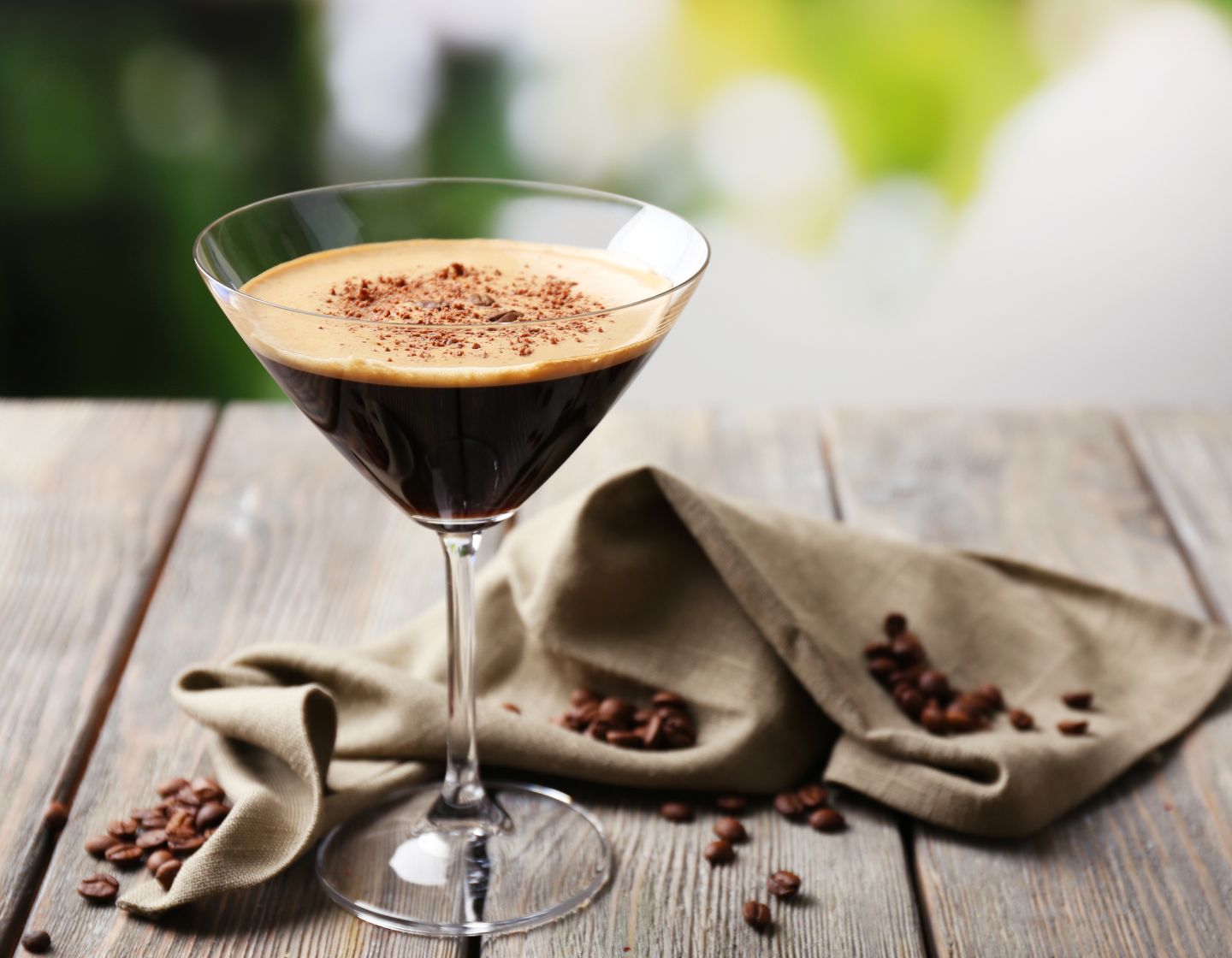 espresso martini with coffee beans around