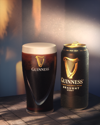 Pint of Guinness Draught in glass beside can of Guinness Draught Stout