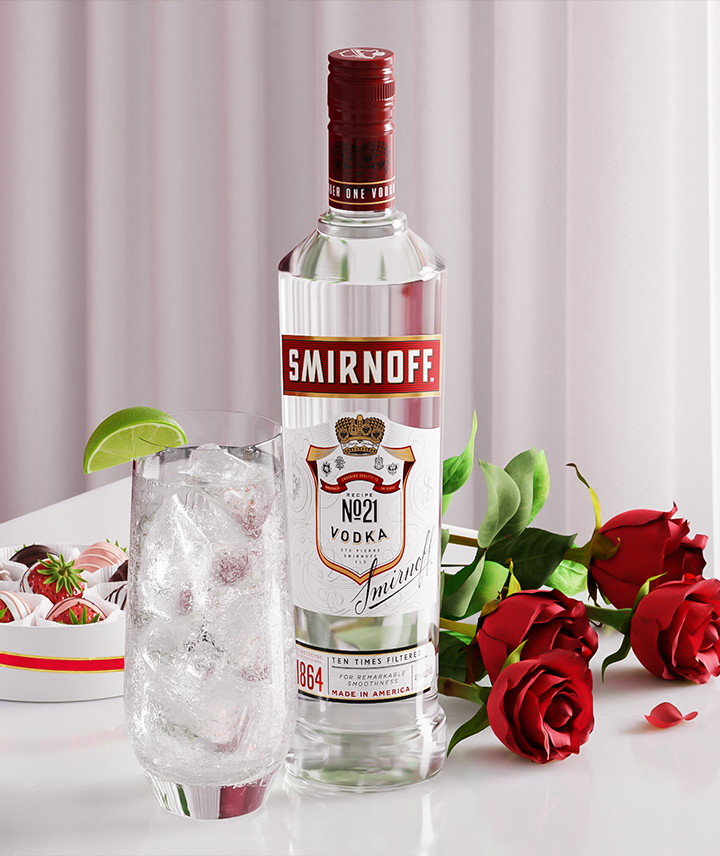 Bottle of Smirnoff vodka, a cocktail in rock glasses next to roses