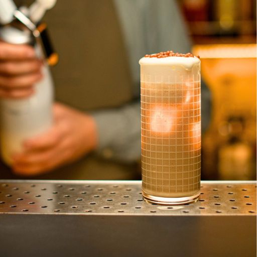 Foam cocktail on a bar.