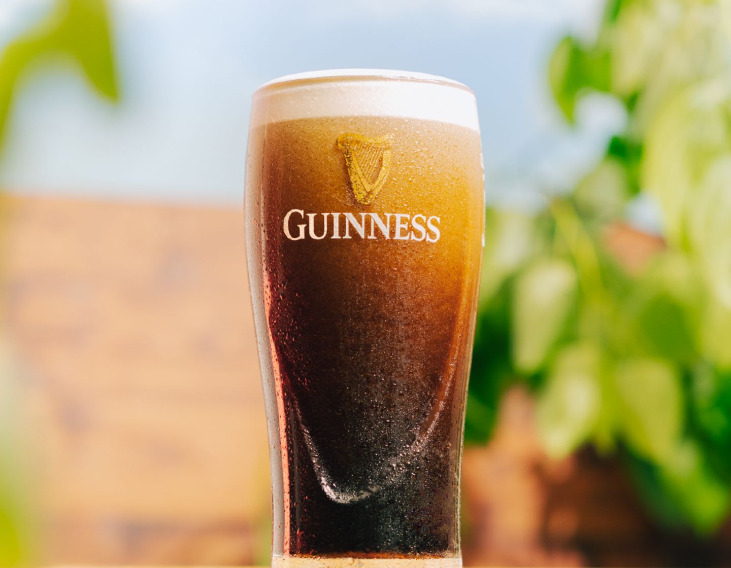 Pint of Guinness sitting on a beer garden table