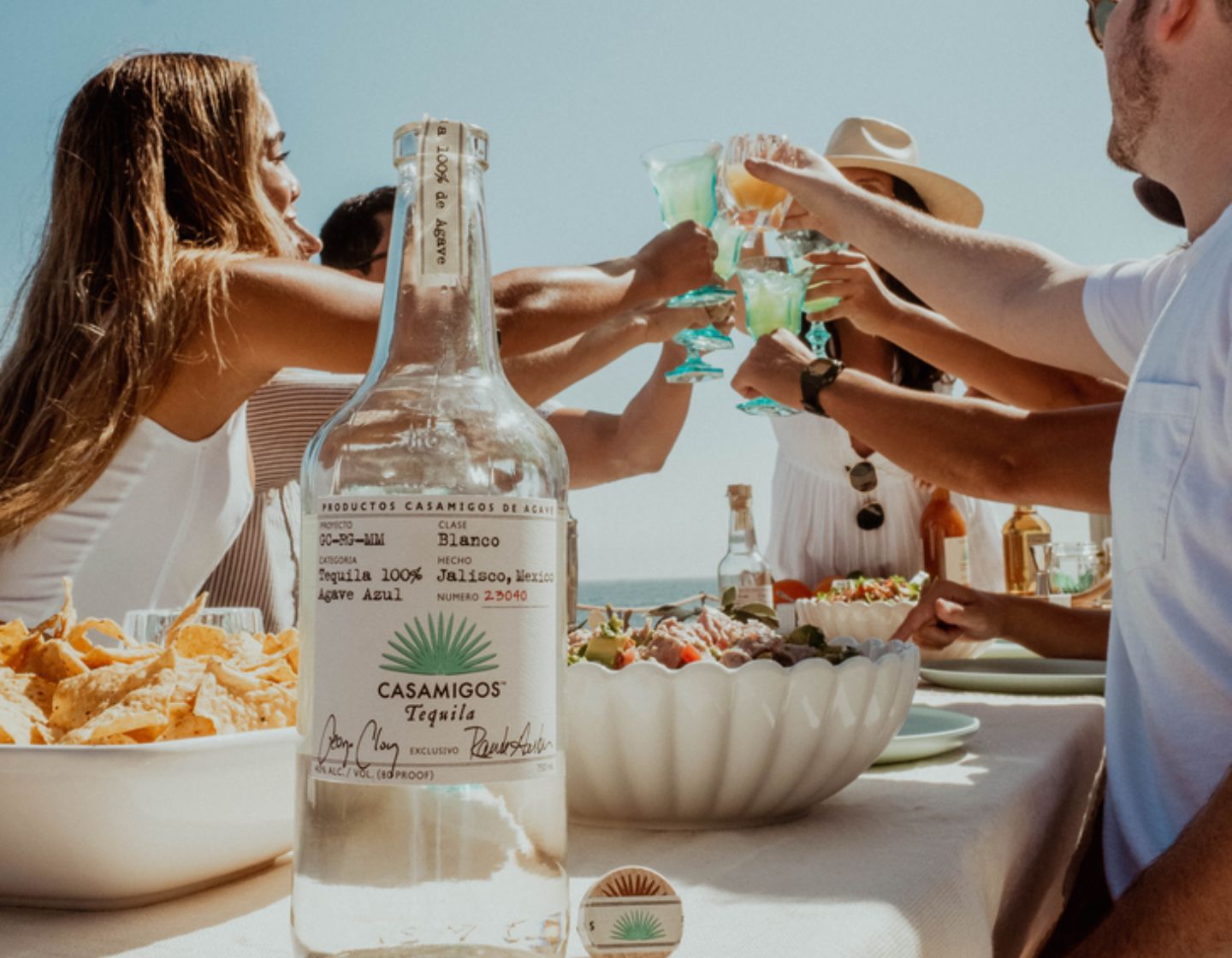 Casamigos bottle on a table of food.