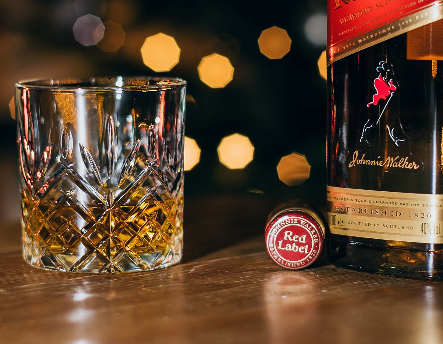 Bottle of Johnnie Walker Red Label with a crystal glass