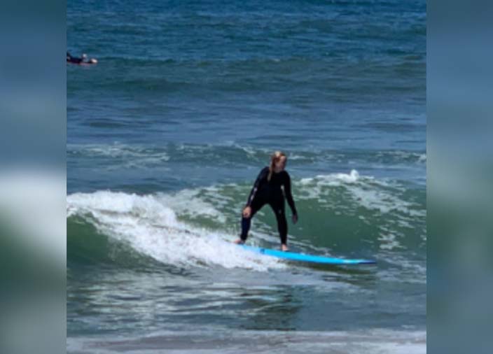 Image of someone surfing a wave