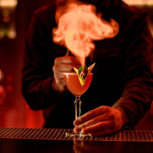 Bartender serving cocktail on fire