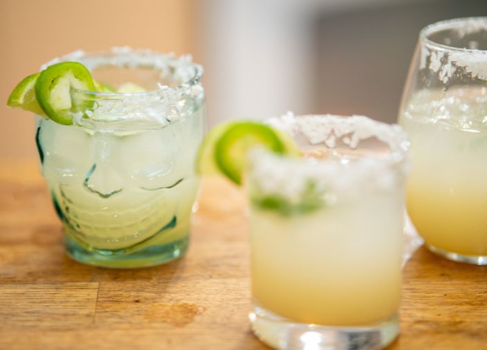 Margaritas with salted rims and lime slices