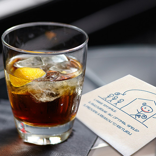 Cocktail with notes on a napkin