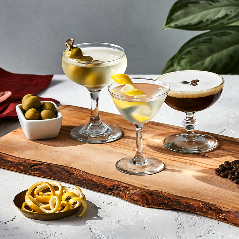 Mini cocktail flight on board with olives