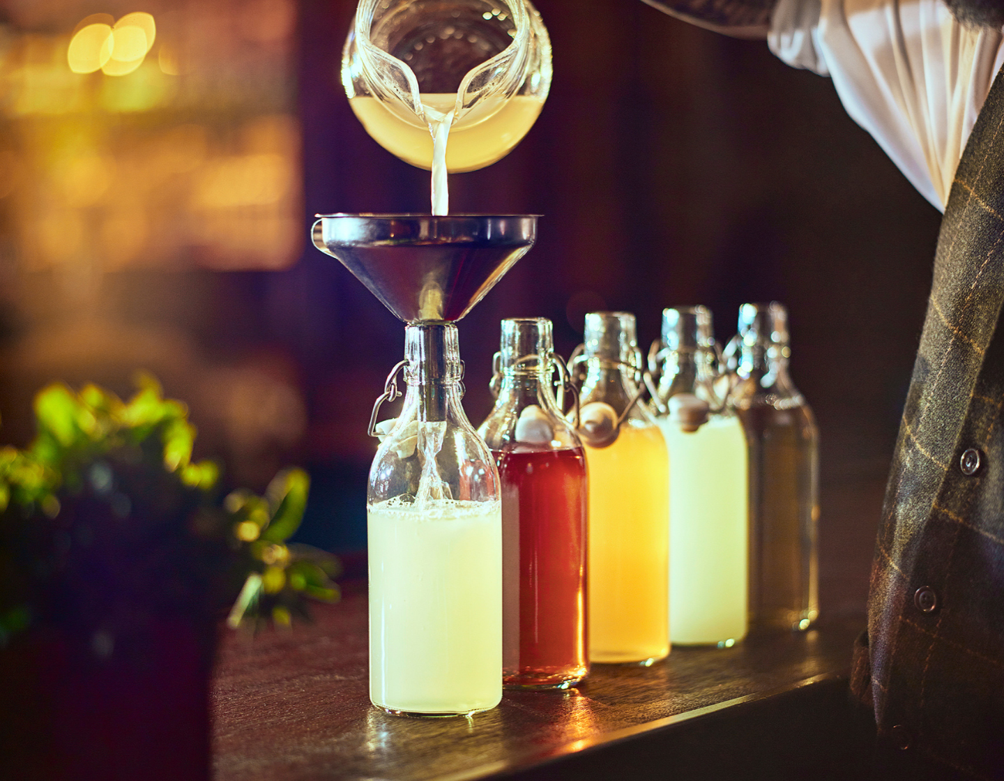 Selection of bottles containing different coloured liquids
