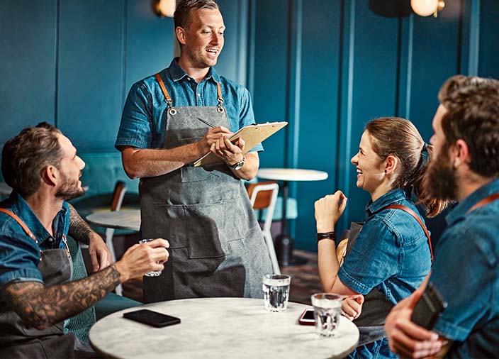 A team meeting being led by the bar manager  