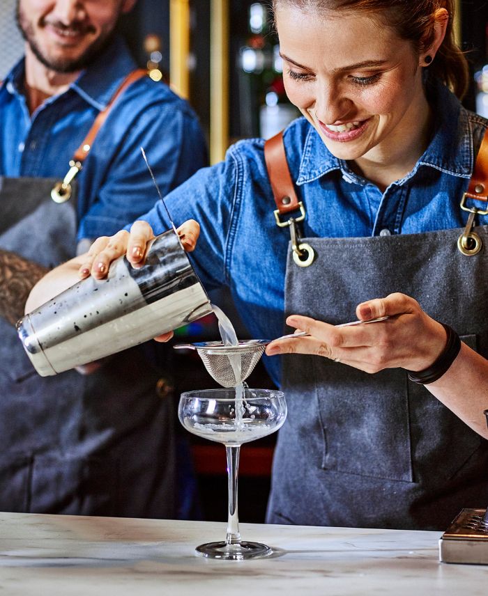 Bartenders preparing cocktails