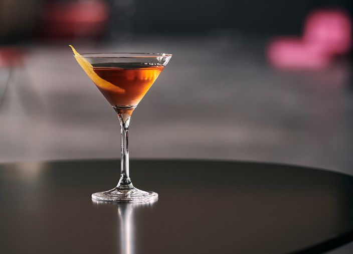 A cocktail with garnish 