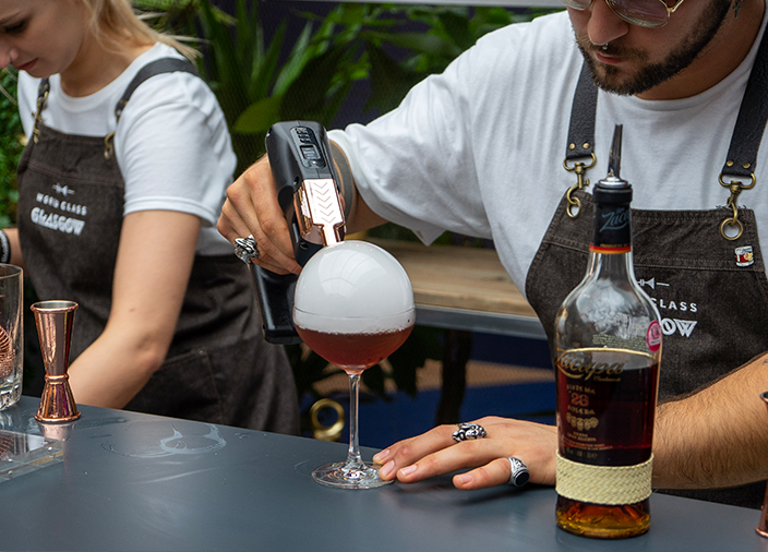 Bartender smoking a cocktail