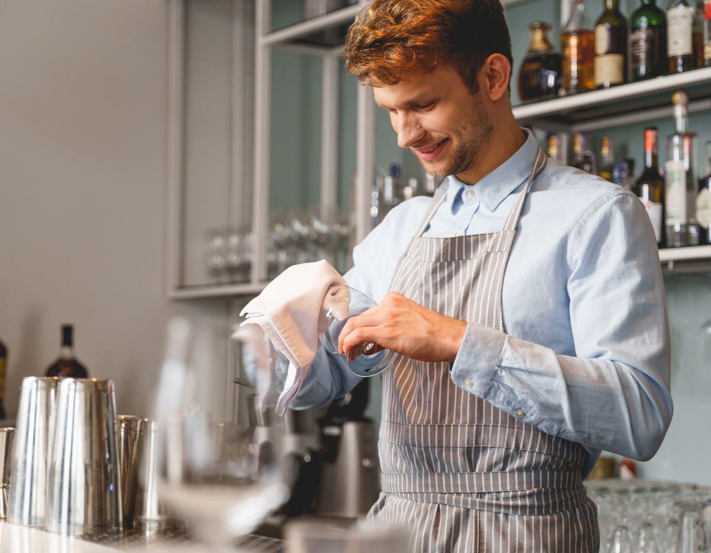 Bartender cleaning the glassware