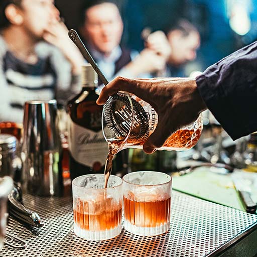  Bartender pouring rum based cocktails