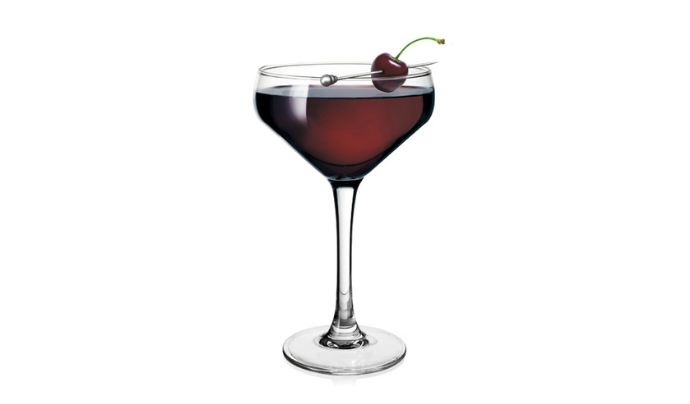 Champagne cup cocktail with cherry garnish