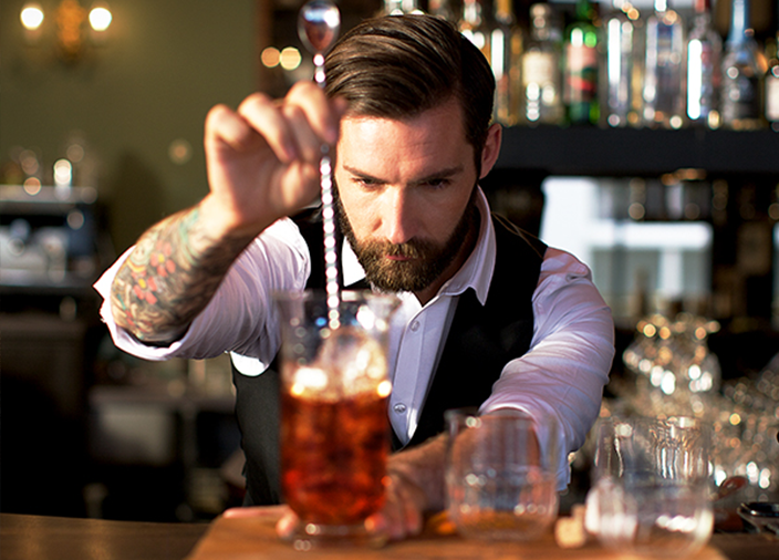Bartender stirring a cocktail
