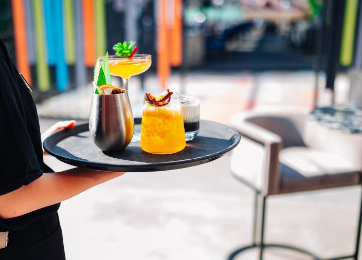 Waiter serving the drinks