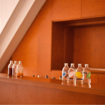 Cocktail bottles lined up along bar