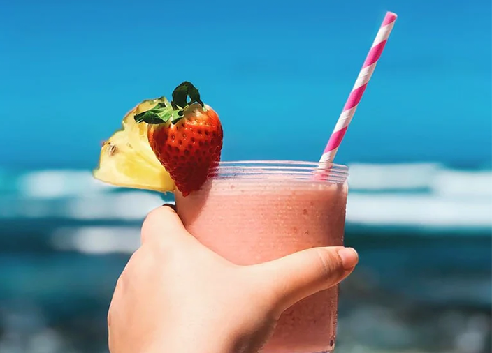 Frozen Cocktail with strawberry garnish and straw