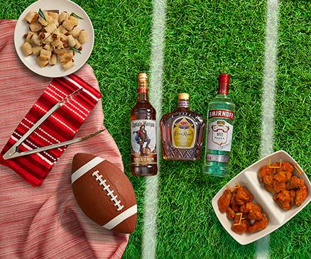 Diageo Branded Liquor Bottles on Football Field and Picnic setup 