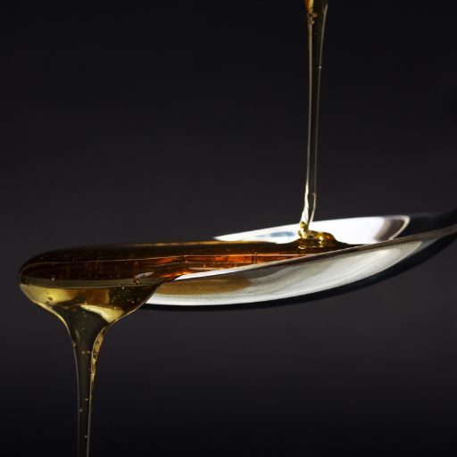 Close up of syrup being poured onto spoon