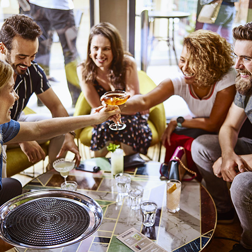 Friends at a party drinking cocktails 