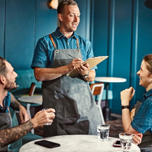 Group of bartenders in a team meeting