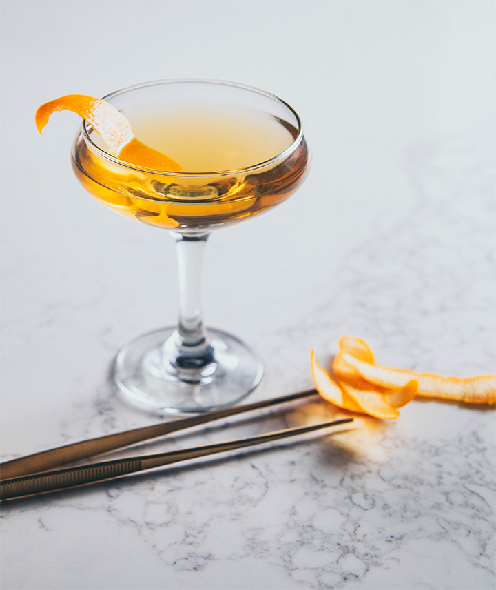 Cocktail in a coupe glass and garnish