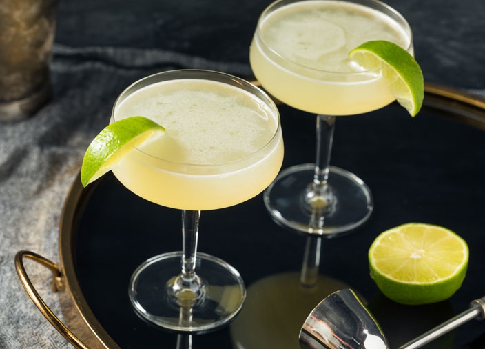 2 cocktails glasses with lime green liquid