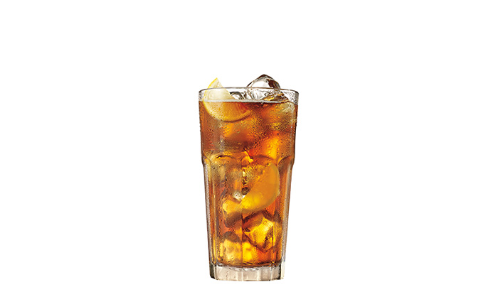 Cocktail in a tall rocks glass with ice