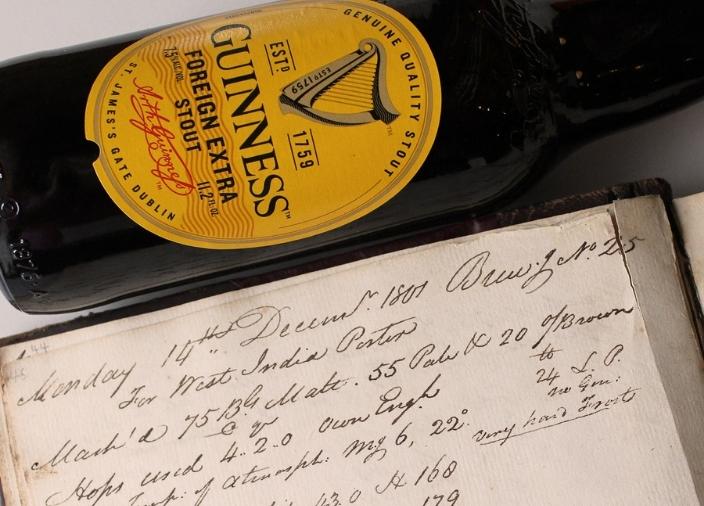 Bottle of Guinness Foreign Extra Stout with handwritten document 