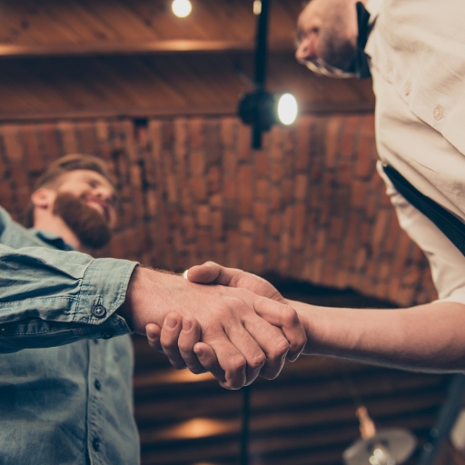 Bar manager and interviewee shaking hands