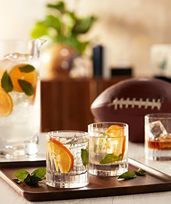 Cocktails in rock glasses with a football 