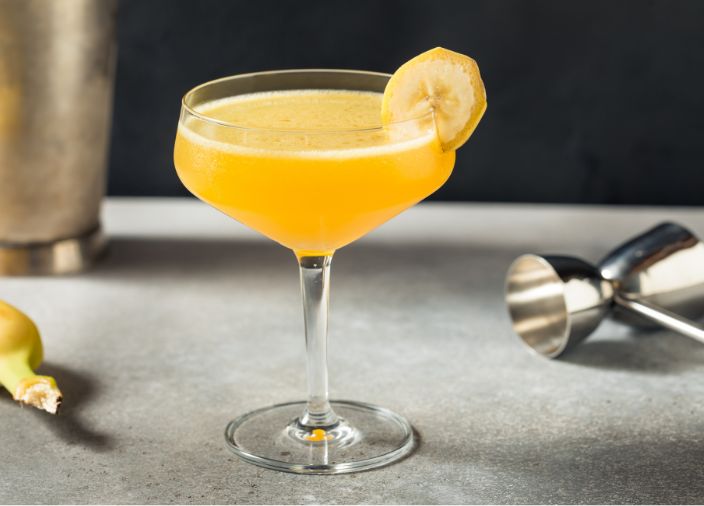 Banana daiquiri in coupe glass with banana garnish