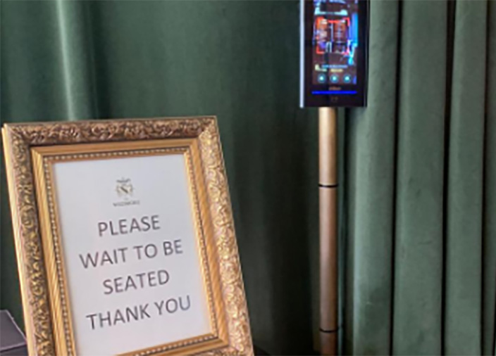 Sign that says Please Wait to be Seated