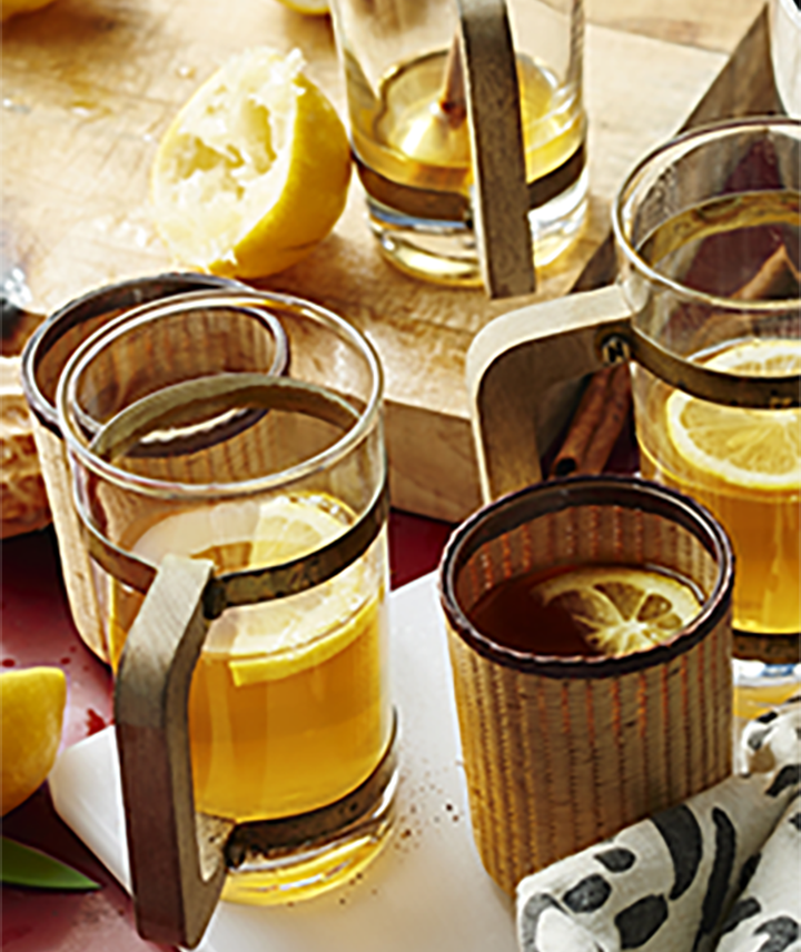 Hot cocktails in glass mugs