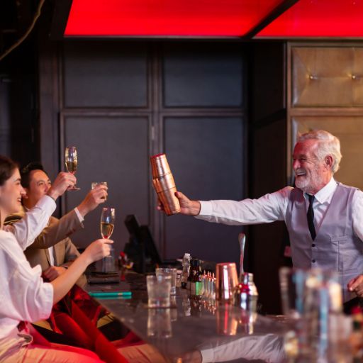  Bartender toasting his shaker with guests 