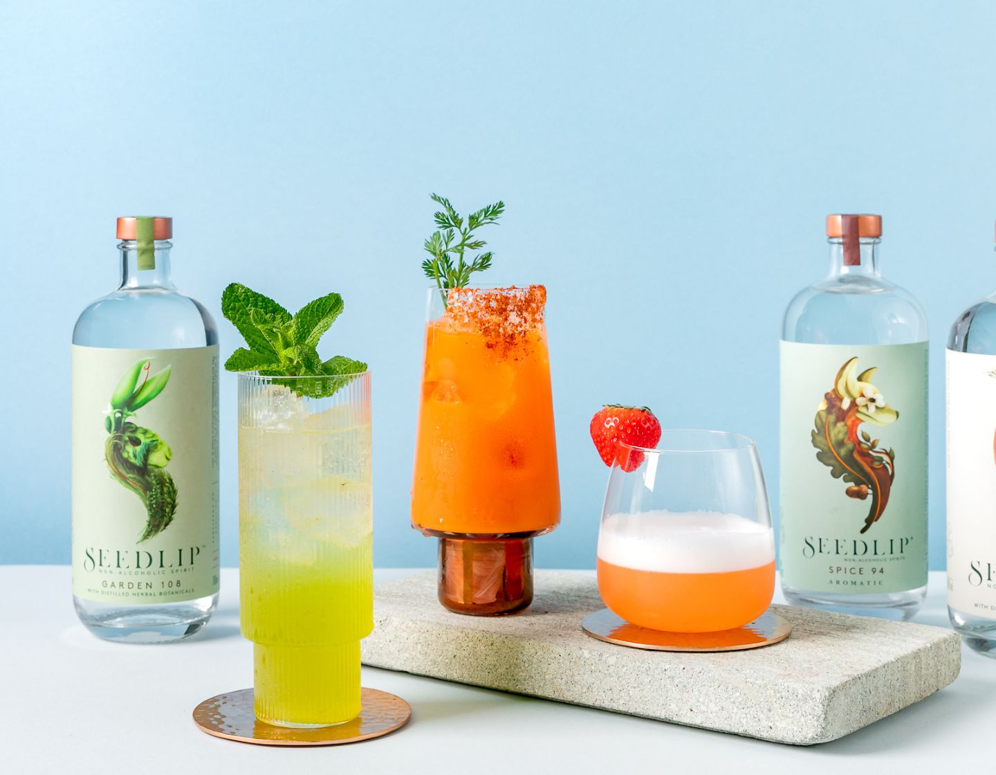 Three Seedlip variants arranged alongside three Seedlip serves    