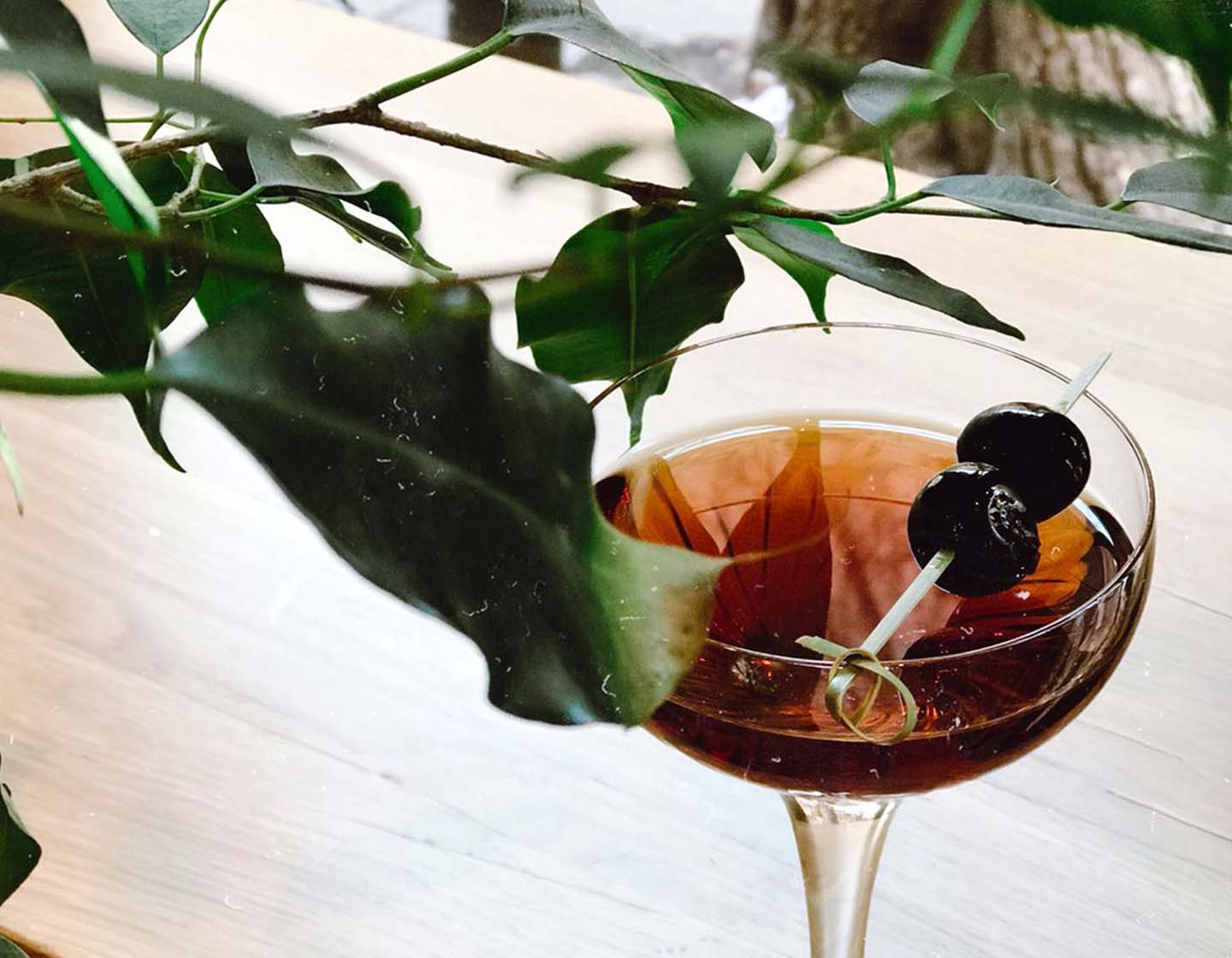 Cocktail with black olives.