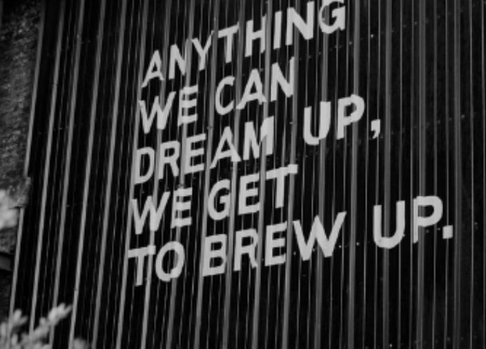 Guiness factory wall art saying anything we can dream up, we get to brew up.